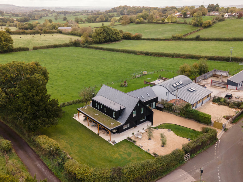 Dewdown Lodge: Re-build of an existing lodge in Somerset to create a stylish and energy efficient family home.